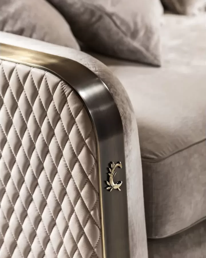 Voyage luxury armchair by Cantori with quilted arms and metal edge, exclusive Italian living room furniture