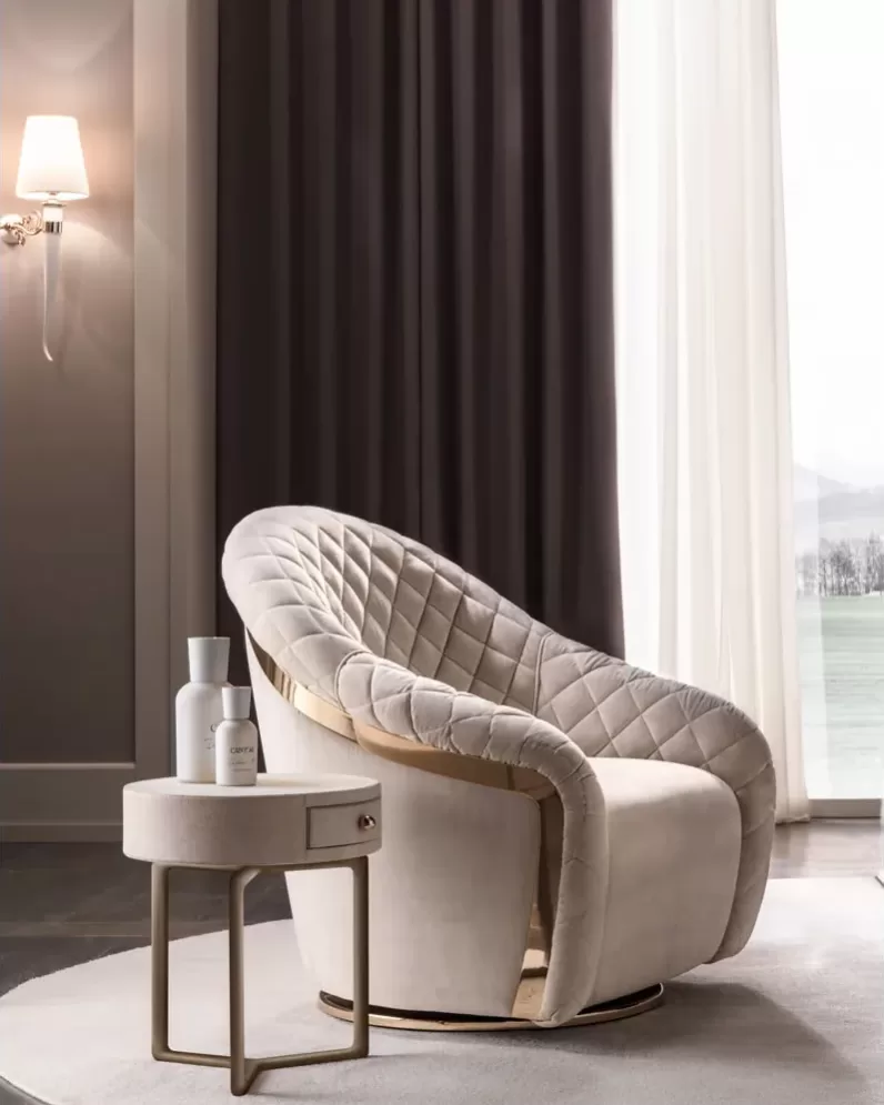 Portofino armchair by Cantori with quilted seat, high-end upholstered armchair shown in an interior