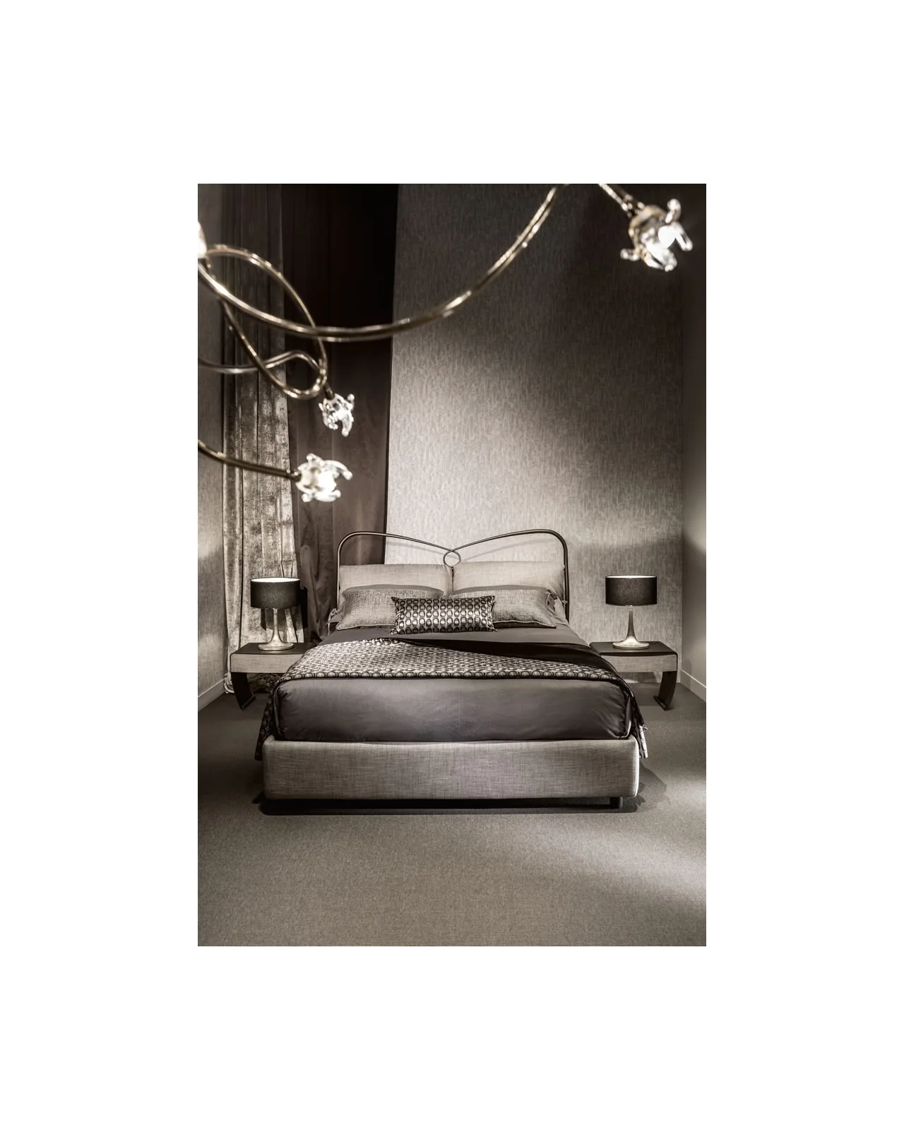 Bed with a metal ring headboard in a bedroom setting, Italian furniture online, made to order in Italy